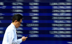 Stocks, dollar stay calm in Asia as oil rises