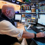 Asian shares are mixed after Wall Street sets more records for US stocks