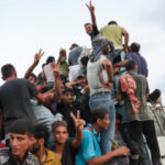At least 20 Palestinians killed after aid truck overturns in central Gaza