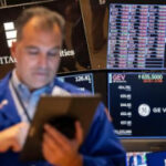 World shares are mixed as Tokyo’s Nikkei jumps nearly 2% on tariff news