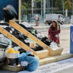 People climb buildings and hand out soap to push for a plastic pollution treaty