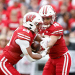 Former Wisconsin quarterback wins starting job with new program