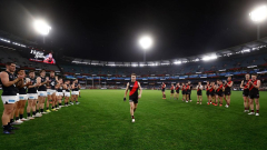 Inspirational Essendon skipper Zach Merrett plays with ‘six holes drilled into his hand’