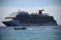 Carnival cruise ship tilts amid rough weather, scattering dishes, flooding elevator