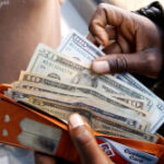 Dollar falls ahead of data releases, risk of US government shutdown looms