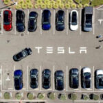 Parents of woman killed in Tesla crash allege design flaw trapped her in burning car