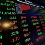 Asian shares are mixed as tech shares lead Wall Street ticks to more records