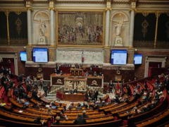 Political crisis in France eases for now as prime minister survives no-confidence vote