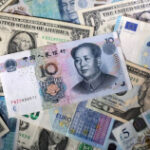 Dollar hits two-week high against yen as trade talks, Fed meeting loom