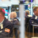 Wall Street futures march higher as deal making takes spotlight from corporate earnings