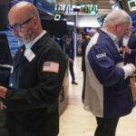 Stocks climb on hopes for lower interest rates as Dow rallies 650 points