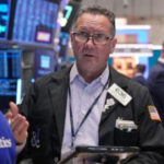 World shares are mixed in holiday-thinned trading with Wall Street closed for Thanksgiving