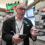 Asian shares are mixed after Wall Street inches closer to its all-time high