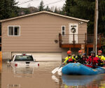 Washington state takes stock of flooding damage as another atmospheric river looms