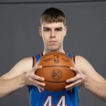 Nikola Topic participates in pregame warmups as he continues cancer treatment