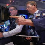 Asian shares advance after Japan raises its key interest rate to its highest level in 30 years