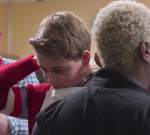 Prince George helps serve up Christmas lunch at homeless shelter