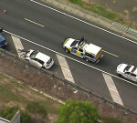 Forest Lake driver fighting for life after getting hit on Logan Motorway in the emergency stopping bay