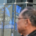 Asian shares, US futures gain as Japan keeps its key interest rate unchanged