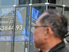 Asian shares, US futures gain as Japan keeps its key interest rate unchanged