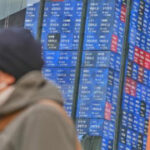 Asian shares are mixed after Wall St sets a record, and the US dollar’s value slides further