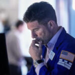 Asian shares are mixed, US futures edge higher as AI fears drag Wall Street lower