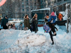 Northeast US digs out from brutal snowstorm that disrupted flights and canceled school