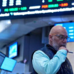 Wall Street ticks up modestly as investors await a major release of oil reserves